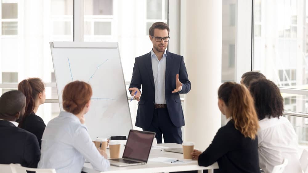 Manager leading a meeting and presenting