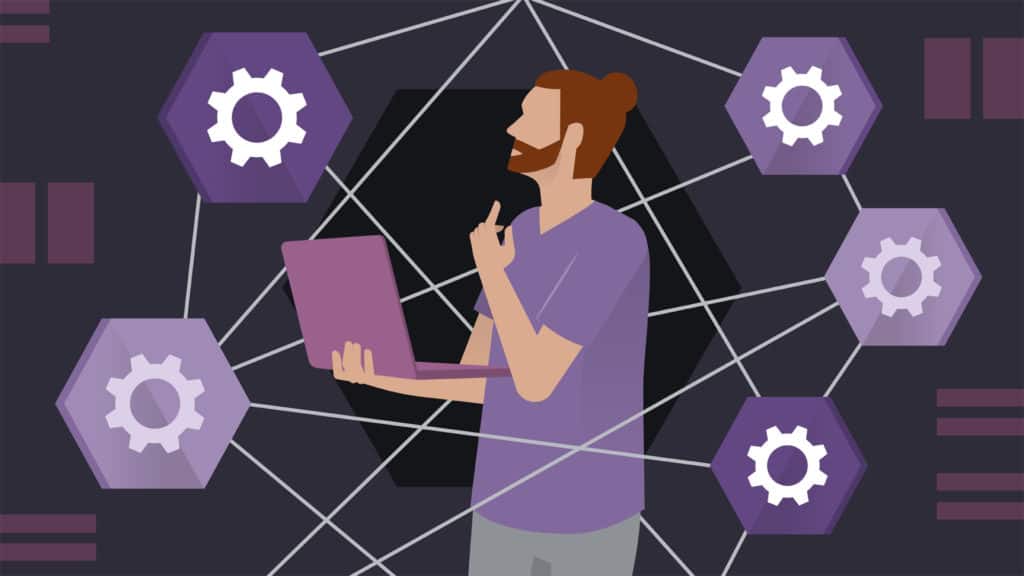 Software developer workingon multiple tasks on his laptop